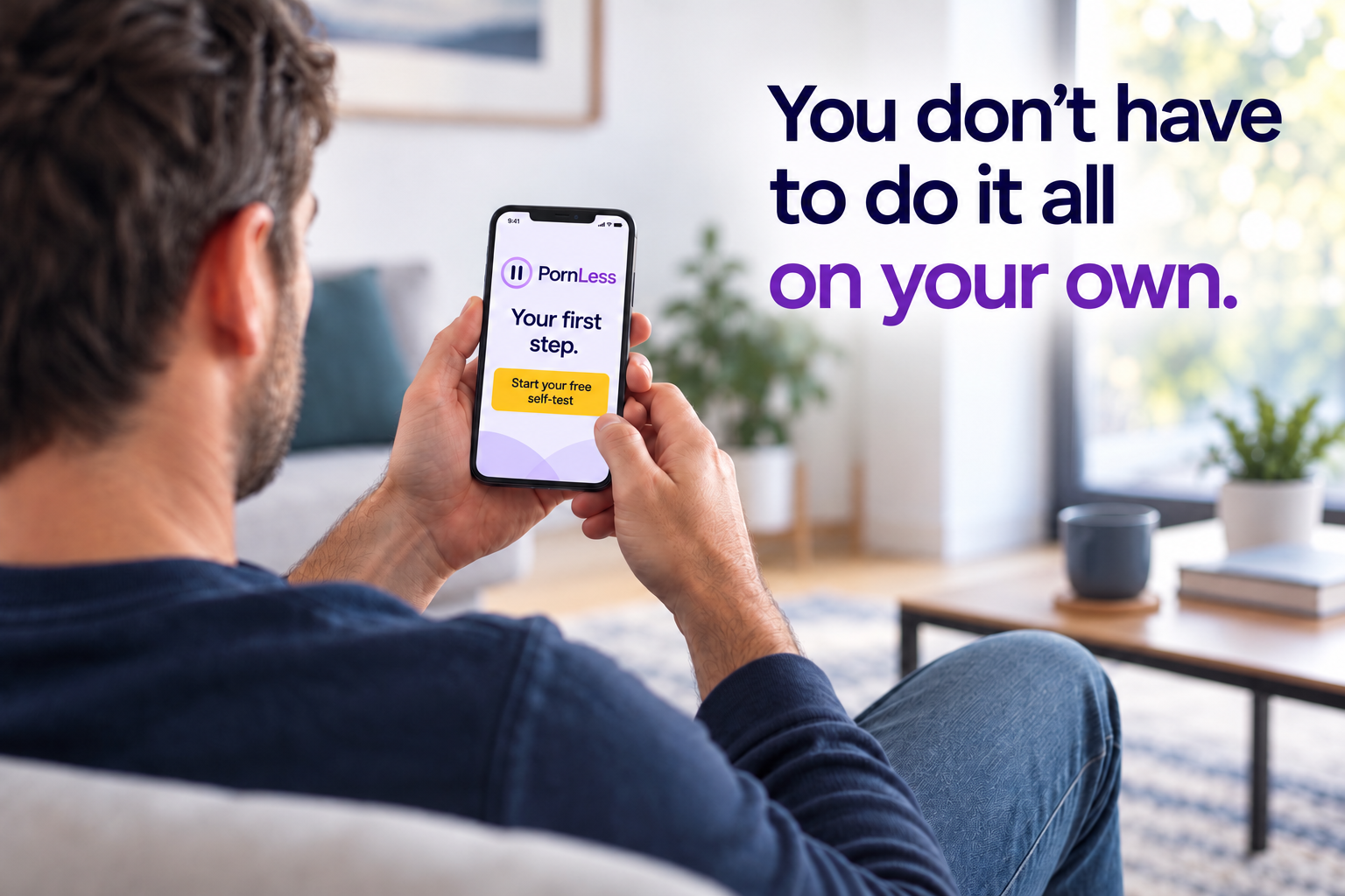 A man looking at the PornLess self-test on his smartphone. You don’t have to do it all on your own.